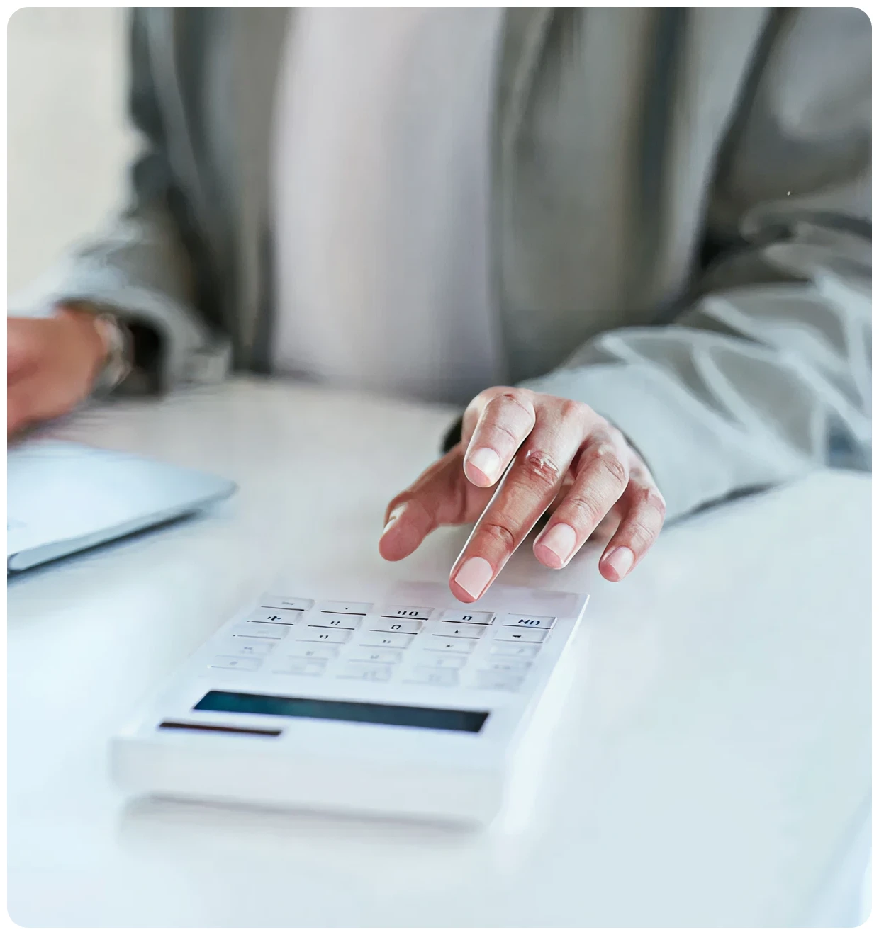 Hand pressing calculator buttons